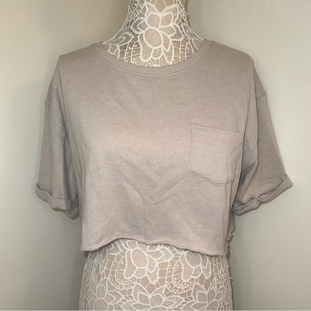 Victoria Sport large beige crop workout shirt.